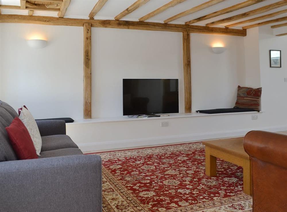 Characterful living room with original beams at The Hop Cottage, 