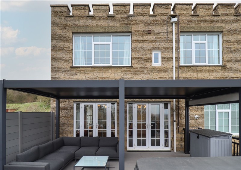 Enjoy a glass of wine on the patio at Castle Top Haven, Nettleton Top near Caistor