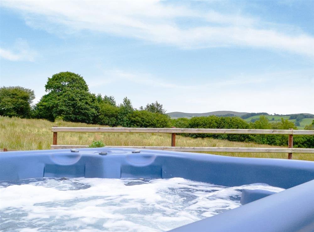 Relaxing hot tub with countryside views at Castle View in Llananno, near Llandrindod Wells, Powys