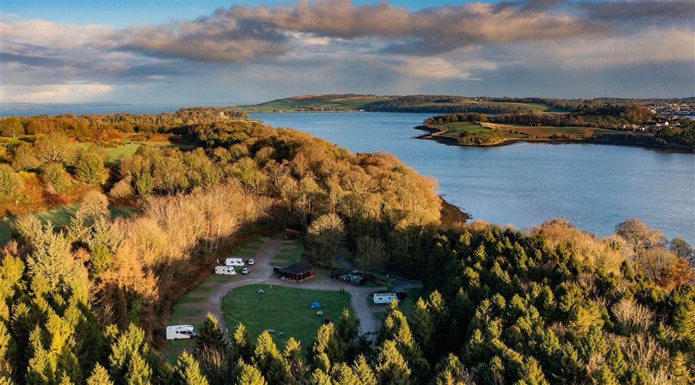An aerial view of Castle Ward Caravan Park and Strangford Lough, County Down at Castle Ward Bunkhouse in Downpatrick, County Down
