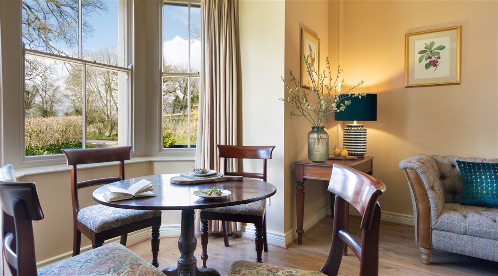 The dining table in the sitting and dining room at Castle Ward Bunkhouse in Downpatrick, County Down