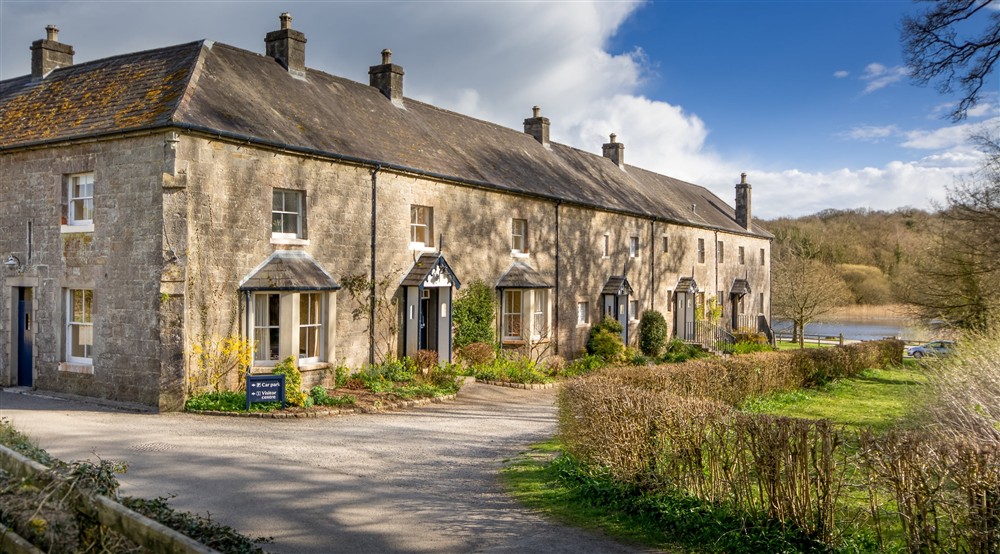 The exterior of cottages on the Crom Estate at Castle Ward Bunkhouse in Downpatrick, County Down