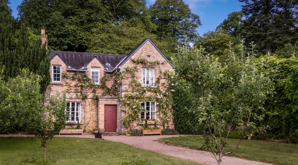 The exterior of Florence Court Rose Cottage, County Fermanagh at Castle Ward Bunkhouse in Downpatrick, County Down