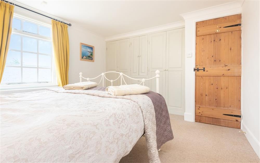 Comfortable king size bed at Cato Cottage in Bridport