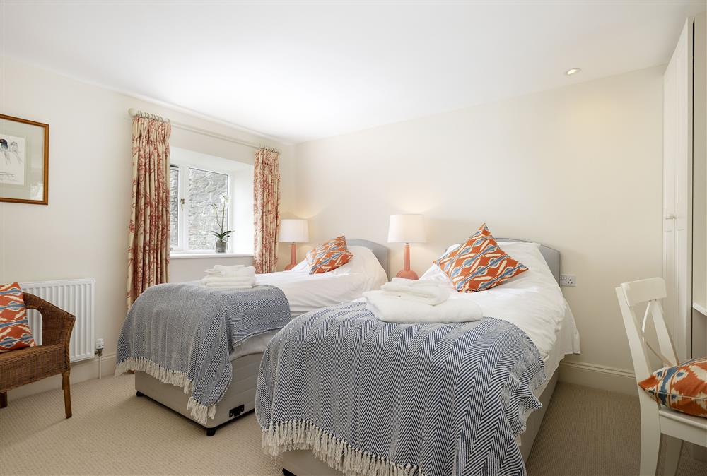 First floor: Bedroom two with 6ft super-king size zip and link bed (shown as twin) at Cats Abbey Cottage, Northleach