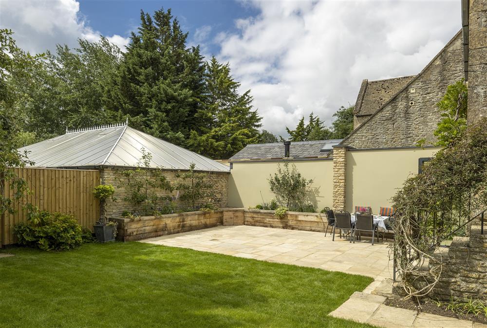 South facing rear walled garden with large terrace and garden furniture  (photo 2) at Cats Abbey Cottage, Northleach