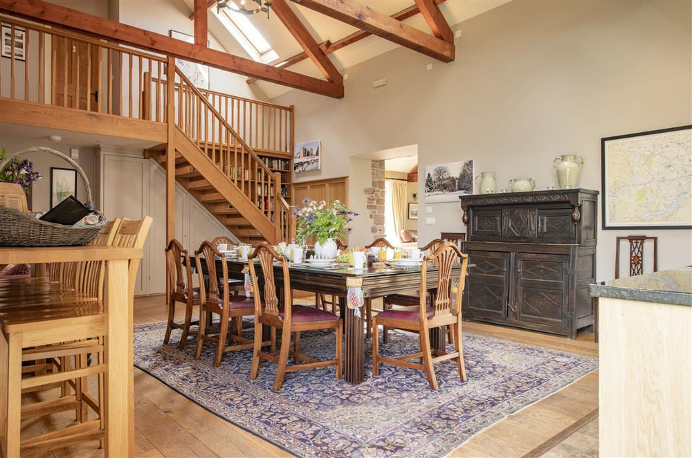 Dining hall with hand built oak staircase leading to the first floor at Cazenovia Hall and Wythburn Cottage, near Greystoke