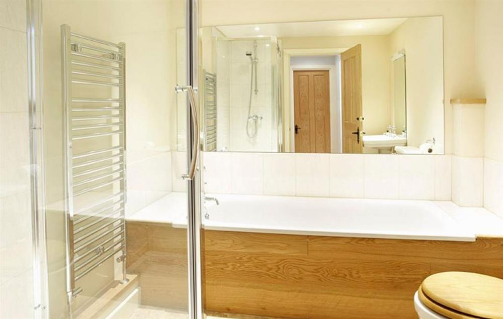 En-suite bathroom with a separate power shower to double bedroom with 5’ bed at Cazenovia Hall and Wythburn Cottage, near Greystoke