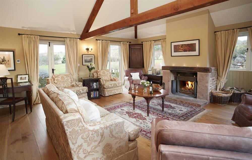 Spacious gin case sitting room with open fire at Cazenovia Hall and Wythburn Cottage, near Greystoke