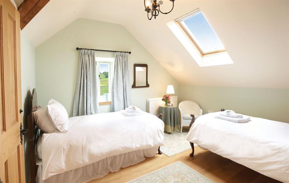 Twin bedroom with 3’ beds which has en-suite shower room at Cazenovia Hall and Wythburn Cottage, near Greystoke