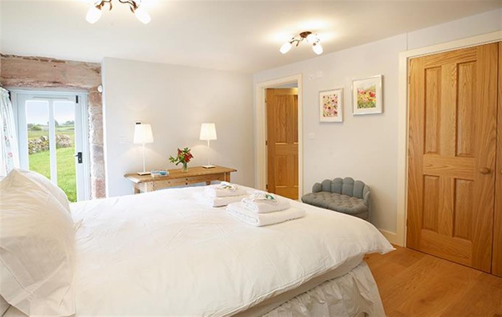 Double bedroom with 5’ bed which has en-suite shower room at Cazenovia Hall, near Greystoke
