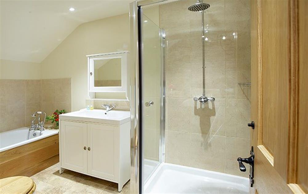 En-suite bathroom with bath and shower to double bedroom at Cazenovia Hall, near Greystoke