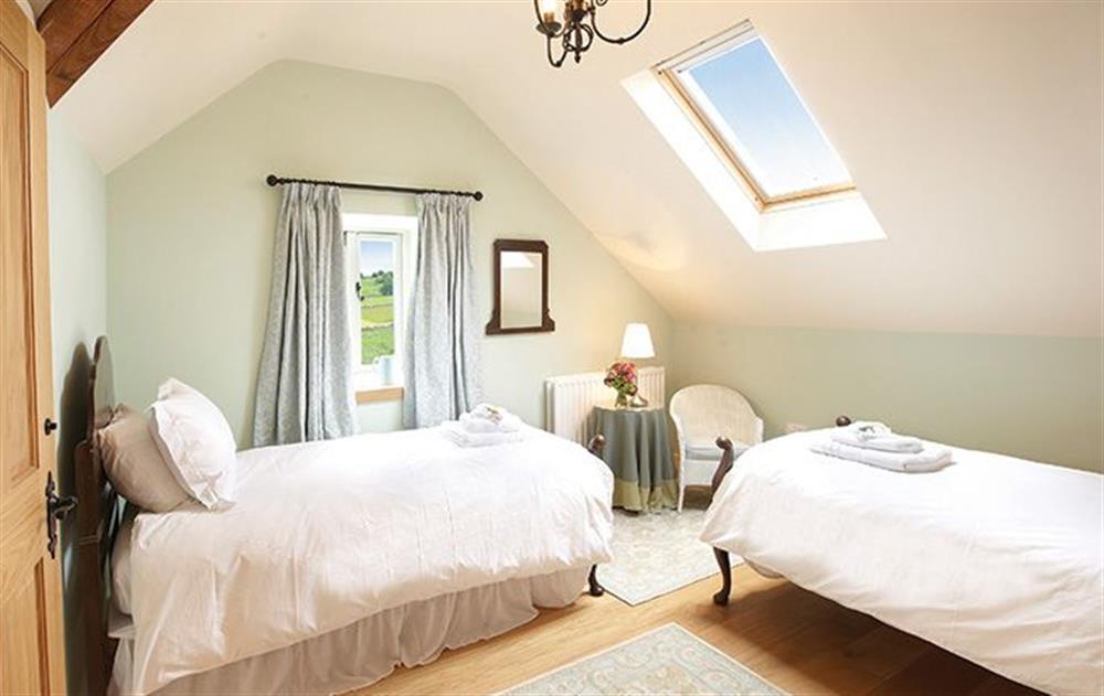 Twin bedroom with 3’ beds which has en-suite shower room at Cazenovia Hall, near Greystoke