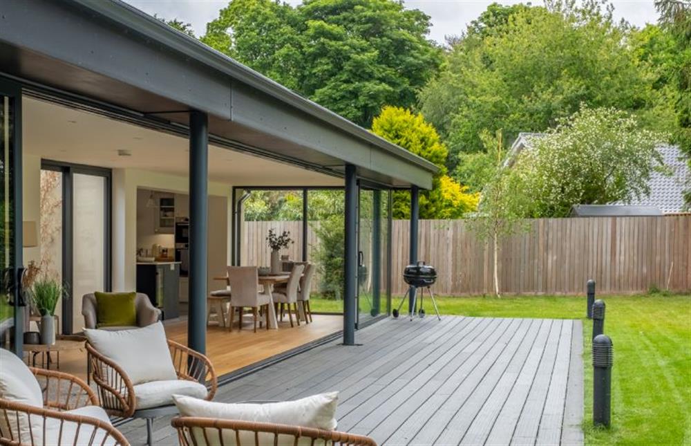 Step out onto the patio and take a seat at Cedar Lodge, High Kelling near Holt