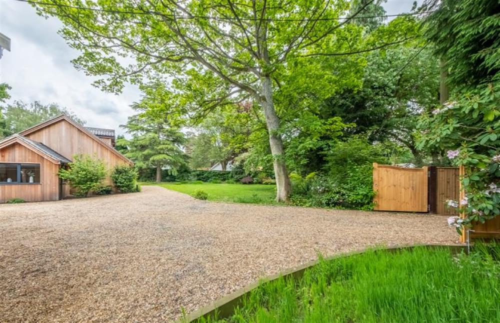 The spacious driveway provides a generous parking area at Cedar Lodge, High Kelling near Holt