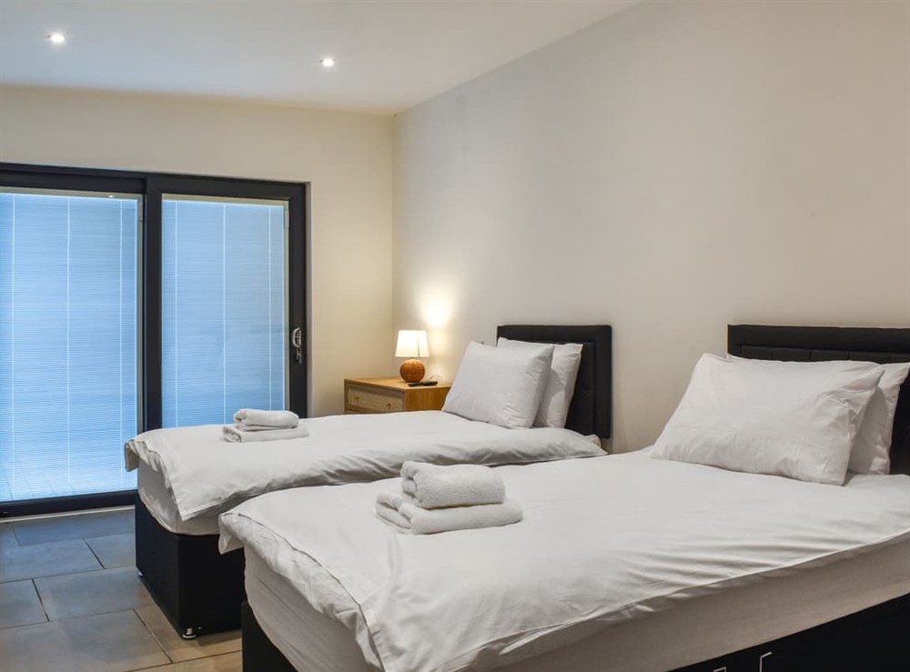 Twin bedroom at Cedar Lodge in Walton Presteigne, Powys