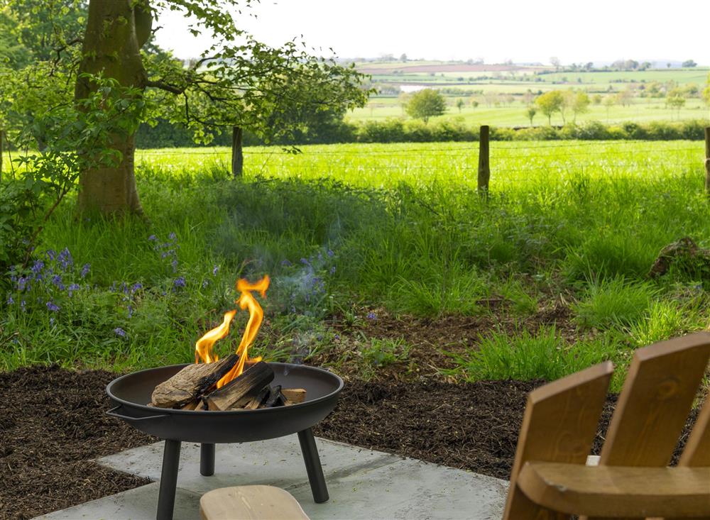 The fire pit provides comforting warmth on cooler nights