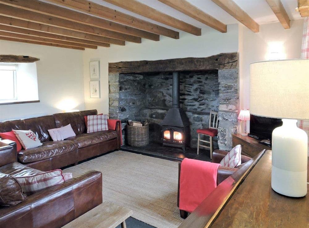 Spacious living room with exposed wooden beams at Cefn Bach in Nr Betws-y-Coed, Gwynedd., Great Britain