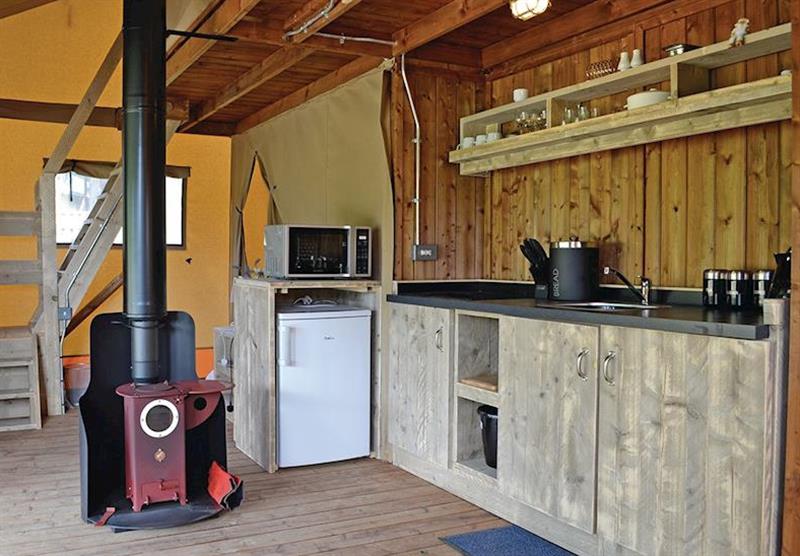 Kitchen and wood burning stove in Foxglove at Celtic Escapes in Narberth, South Wales