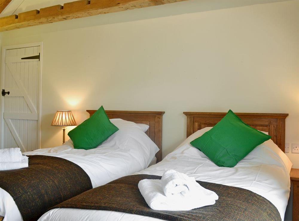 Beamed twin bedroom at Dolgoed House, 