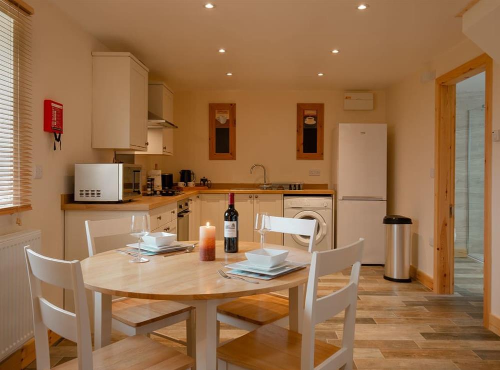 Fully appointed kitchen with dining area at Curlew Cottage, 