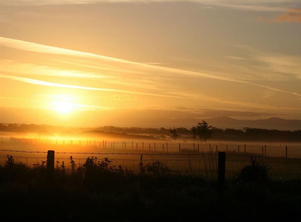 Sunrise over the meadow at Cerrig Cottages at Curlew Cottage, 