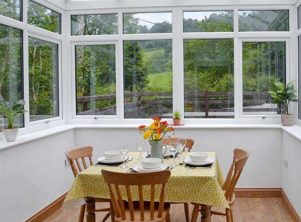 Delightful sun room with dining area at Ysgoldy Salem, 