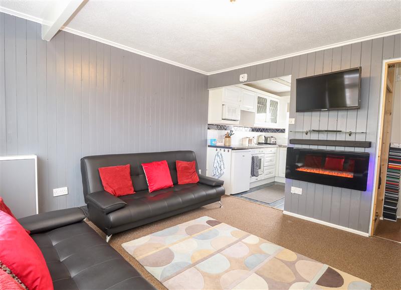Relax in the living area at Chalet 156, Hemsby