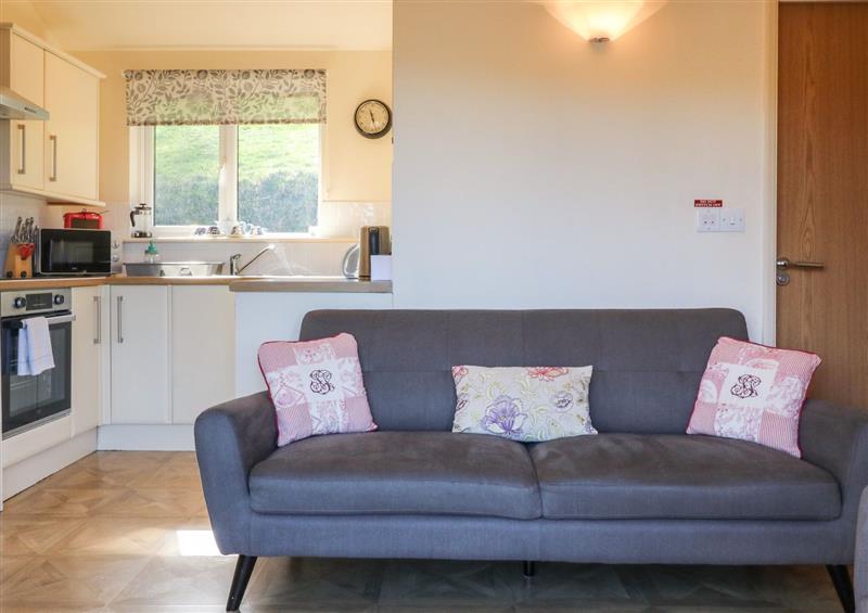 Relax in the living area at Chalet Log Cabin L12, Combe Martin