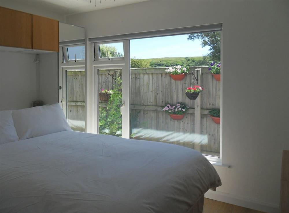 Comfortable double bedroom at Chalet One in Bridport, Dorset