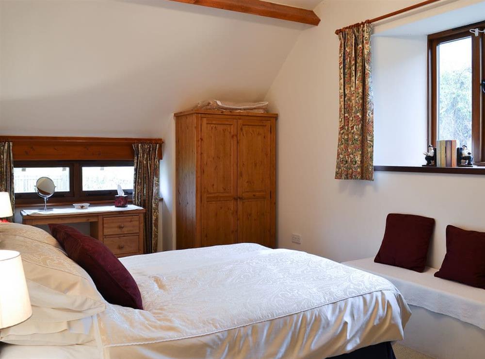 Double bedroom with exposed woodwoek at Chalgrove in Soar, near Brecon, Powys, Wales