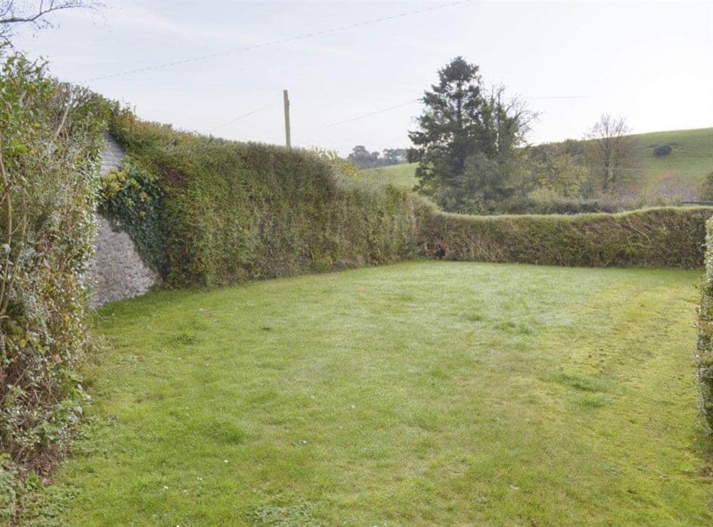 Lawned garden area at Champernowe in Dartington, Totnes, Devon