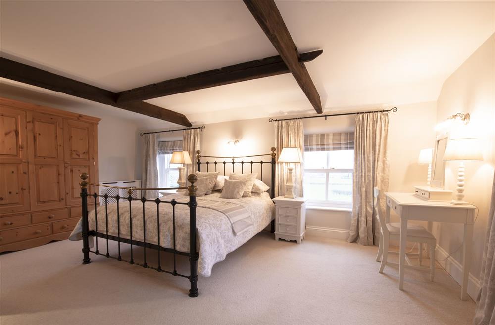 Chance Cottage, North Yorkshire: Bedroom two with a 5ft king-size bed and an en-suite bathroom at Chance Cottage, Nr Leyburn