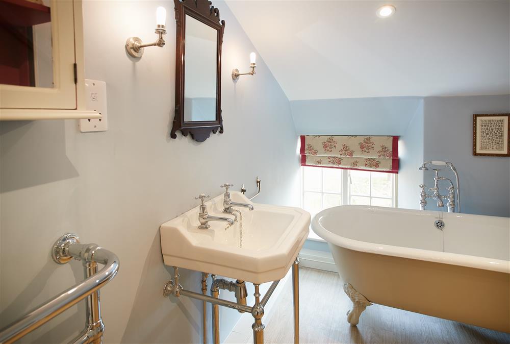 Bathroom with roll-top bath and separate walk-in shower at Chanting Hill Farmhouse, Castle Howard Estate, Welburn