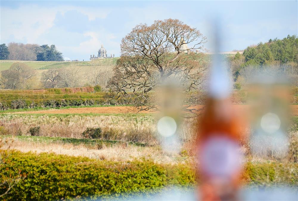 Enjoy stunning views of the Castle Howard Estate from the patio at Chanting Hill Farmhouse, Castle Howard Estate, Welburn