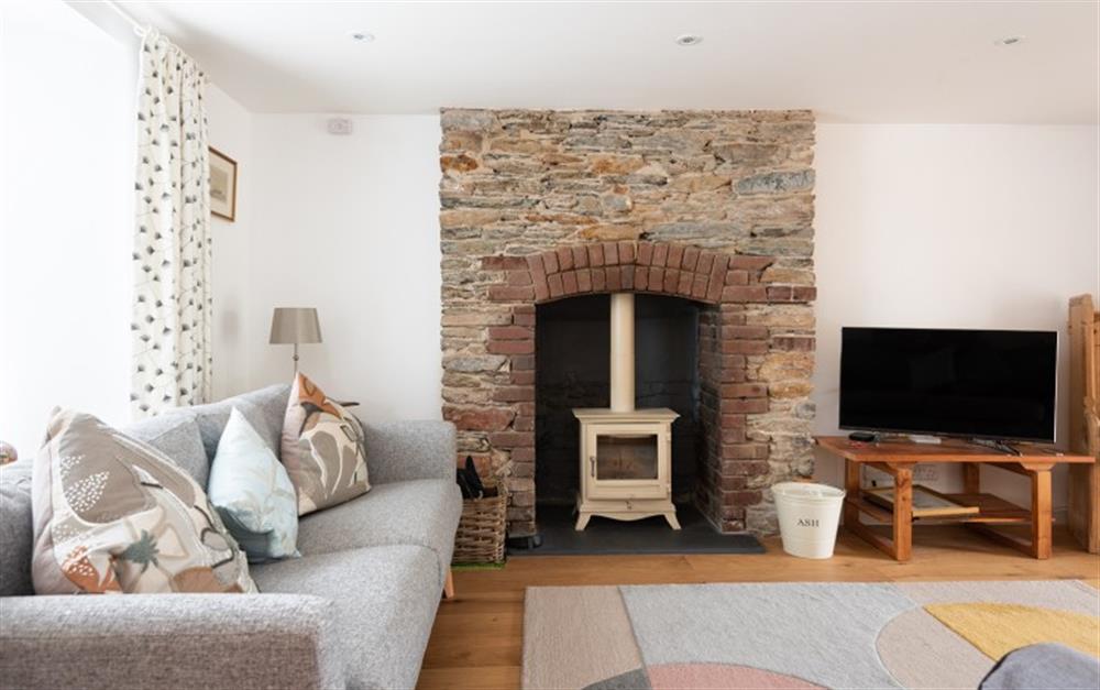 Log burner in the sitting room at Chantry Cottage in Dittisham