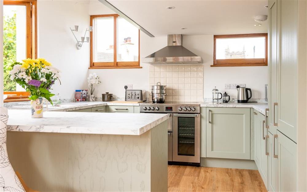 Open plan fully-fitted kitchen at Chantry Cottage in Dittisham