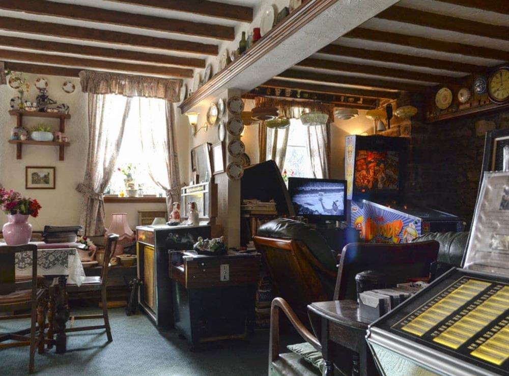 Quirky living room complete with pin ball machine at Chapel Cottage in Pontsticill, Brecon Beacons, Mid Glamorgan