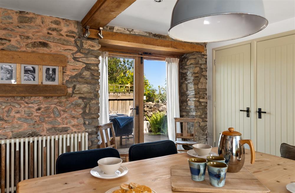 The dining table with doors onto the patio