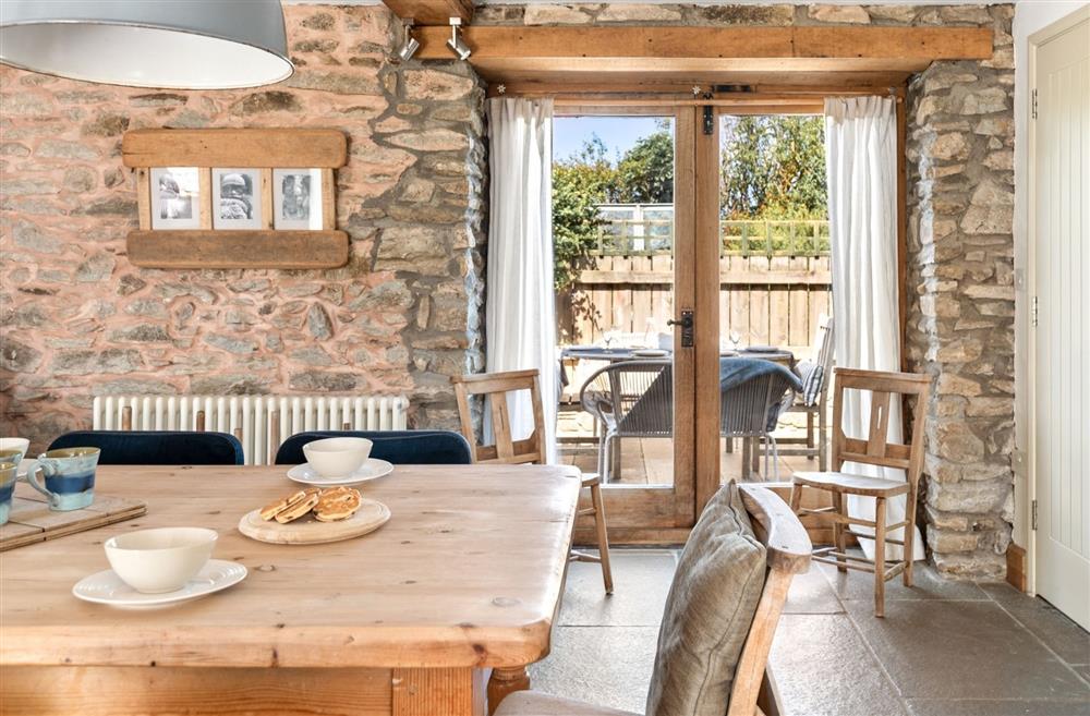 The dining table with doors onto the patio