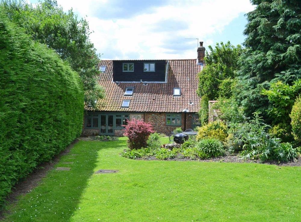 Lush, well planted garden to rear at Chapel Cottage in Thornage, near Holt, Norfolk