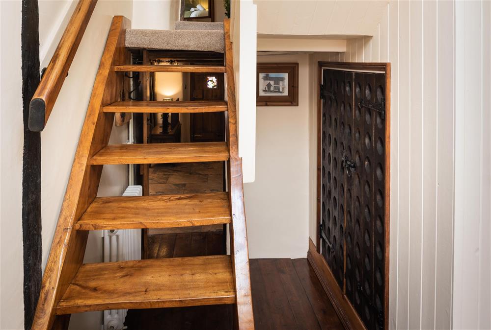 Hand-crafted elm stairs leading to the first floor at Chapel Cottage,  Uffculme