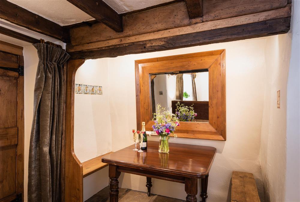 Secluded dining area within the sitting room at Chapel Cottage,  Uffculme