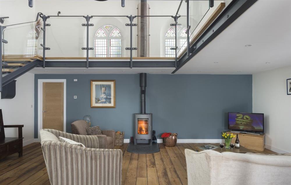 Open plan living area with wood burning stove at Chapel House, Bampton