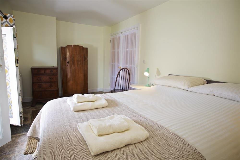 Double bedroom (lower ground floor) with King-size bed at Chapel House in , Dartmouth