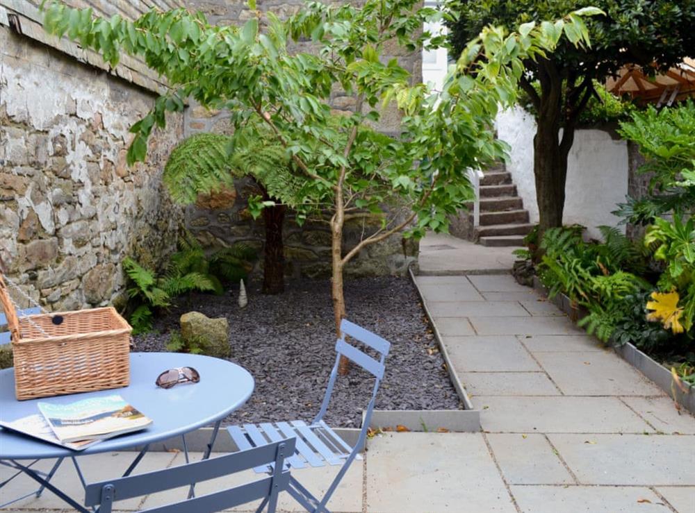 Enclosed courtyard with patio, garden furniture and BBQ (photo 2) at Chapel Street in Penzance, Cornwall