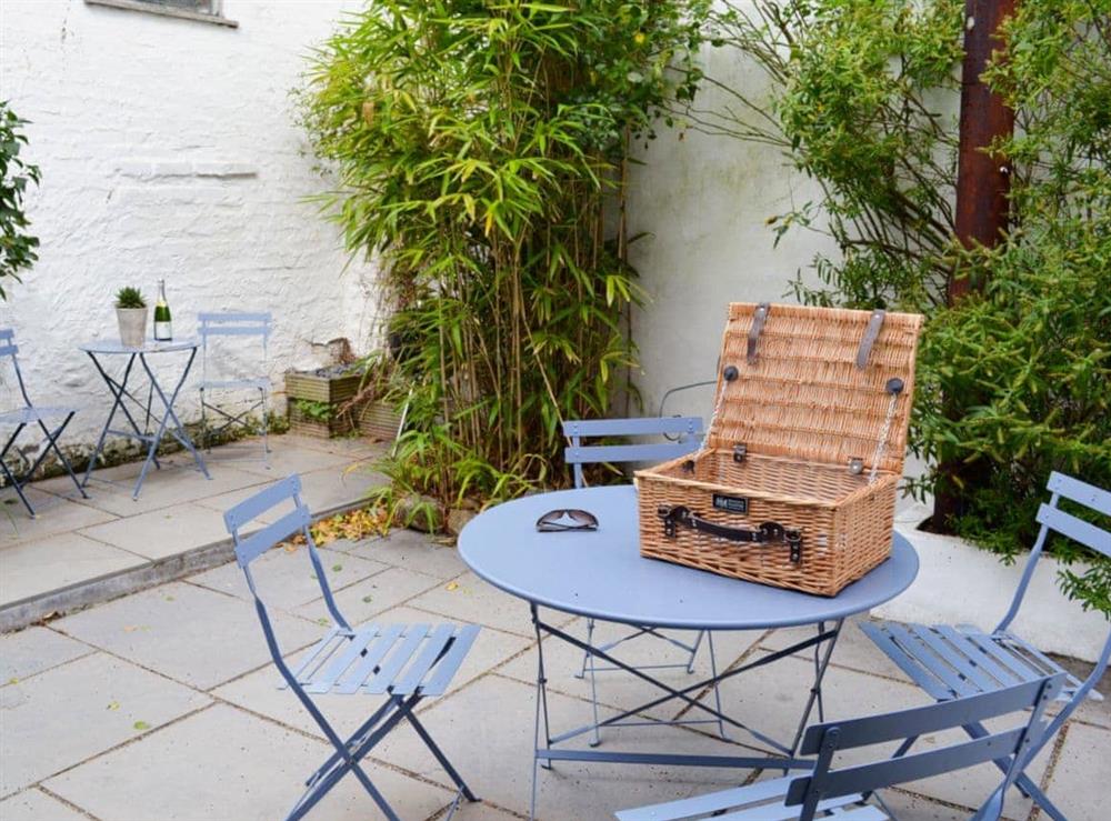 Enclosed courtyard with patio, garden furniture and BBQ (photo 3) at Chapel Street in Penzance, Cornwall