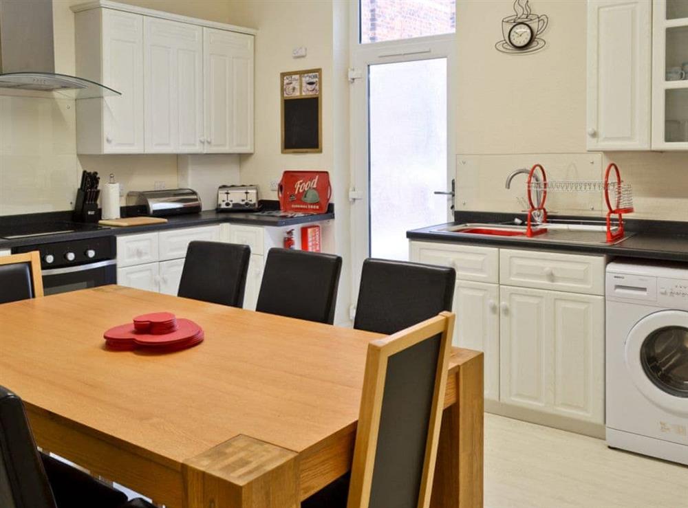 Kitchen with dining table at Chapel View in Filey, North Yorkshire