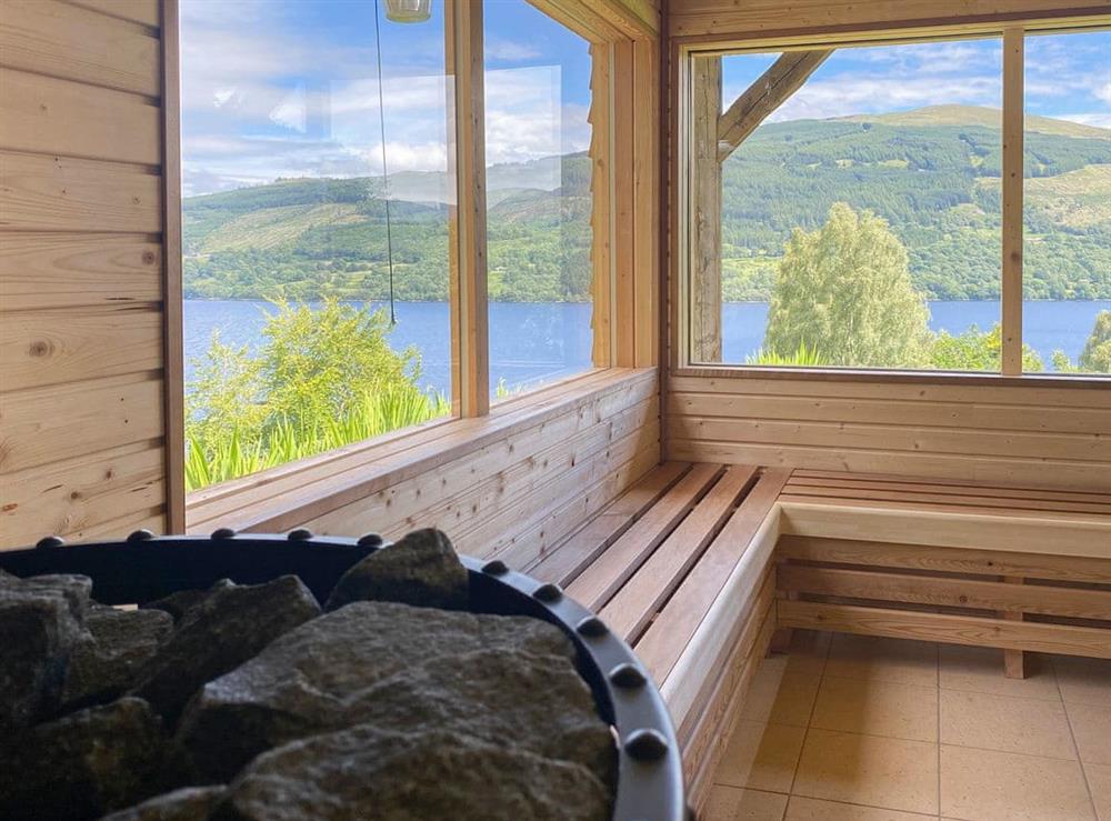 The view from the woodburning sauna, adjacent to the waterfall freshwater pool for cooling down at Chapelburn in Fearnan, near Aberfeldy, Perthshire