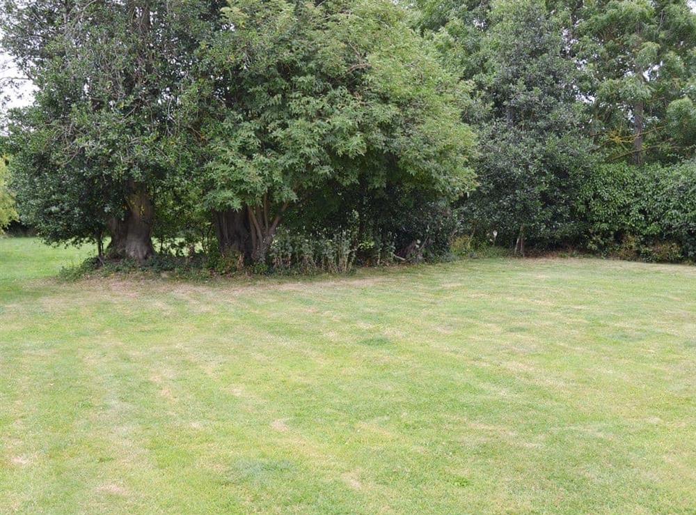 Extensive lawned garden at Chapelfield Apartment in Stalham, Norfolk